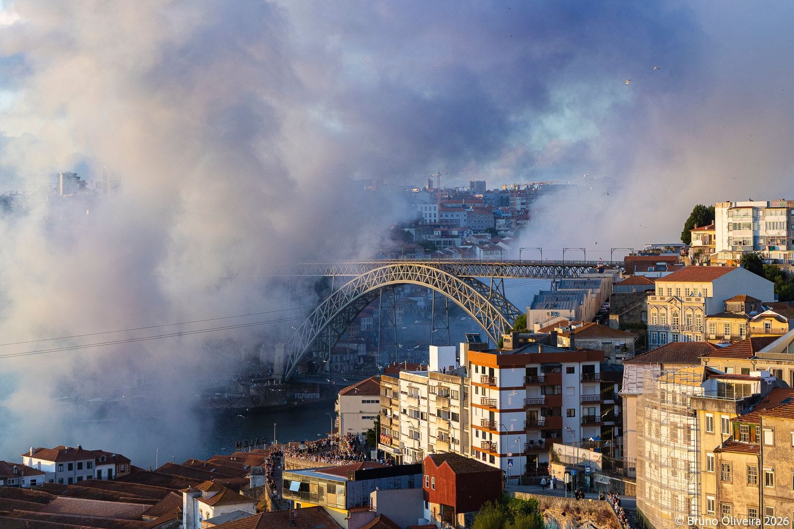 The Dom Luís I Bridge is partially shrouded in blue and white smoke during “One Page”.